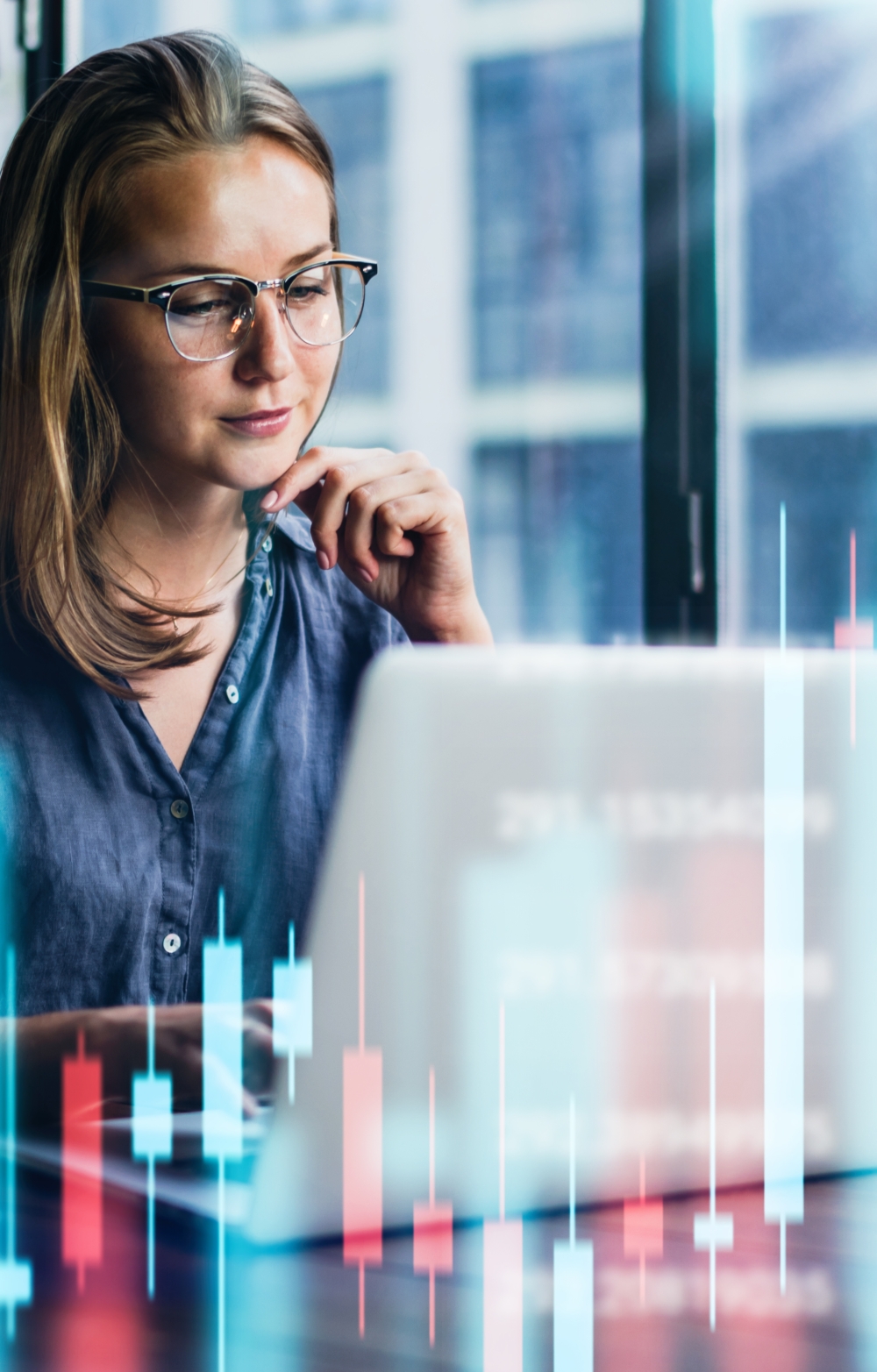 Lady with glasses looking at a computer screen in a virtual data setting with bar charts