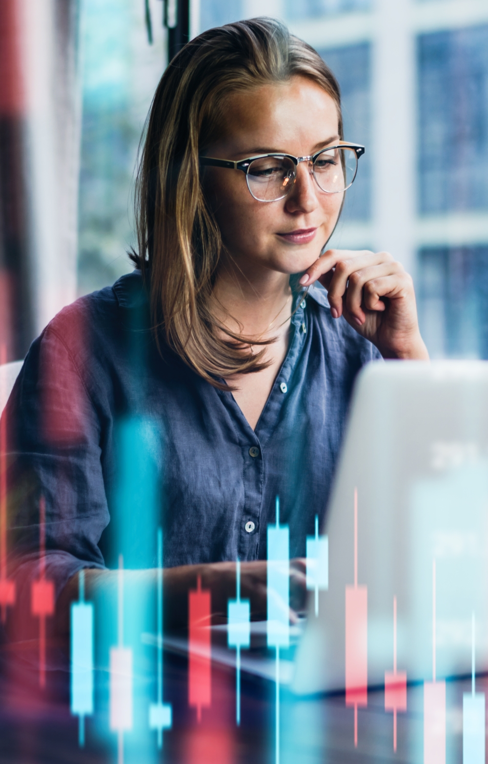 lady looking pensively at a laptop screen on a virtual colorful background