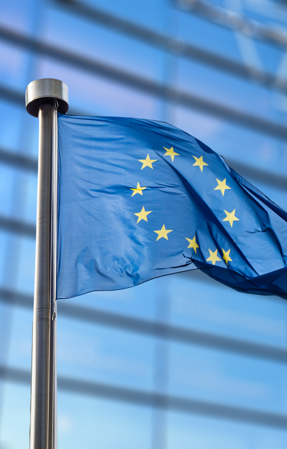 Flag of the EU floating on the background of the European Commission