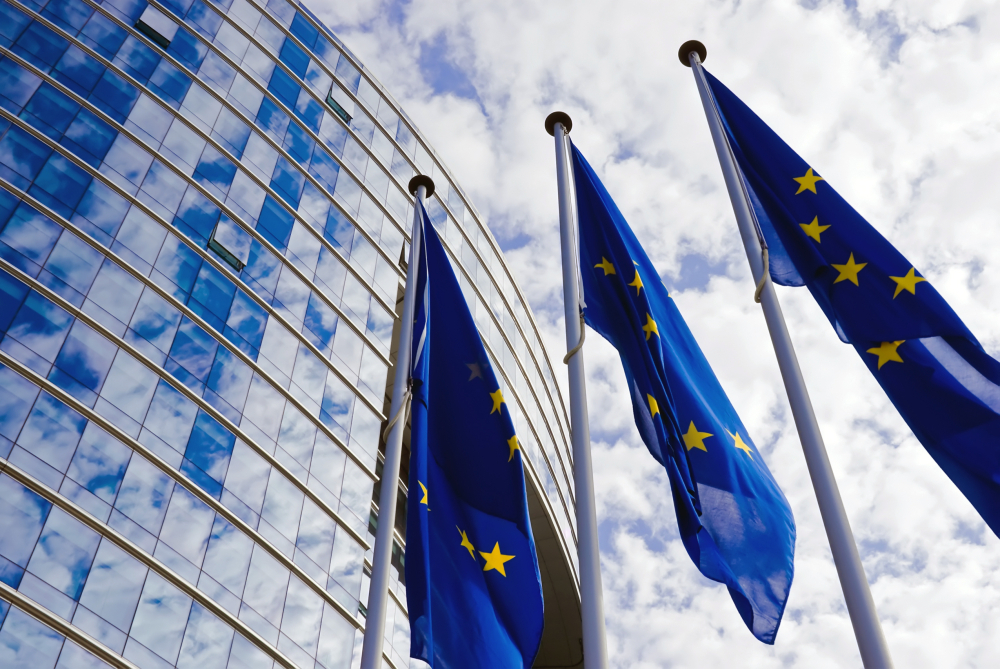 EU flags against blue sky background
