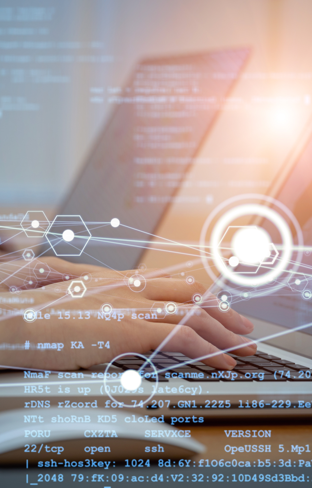 hands typing on a laptop keyboard