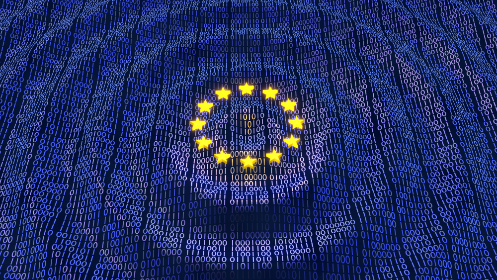 Circle of EU stars against a textile like blue background