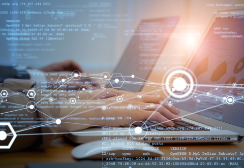 hands typing on tablets